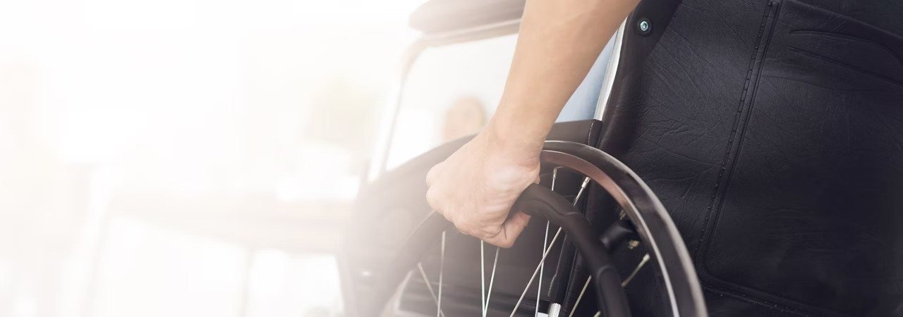 A pilgrim in a wheelchair, representing accessible Umrah travel